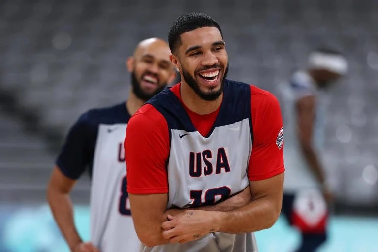    Two Celtics Jayson Tatum and Derrick White share a laugh during a Team USA practice   